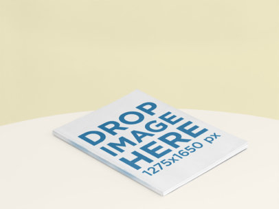 Angled Magazine Mockup Lying on a Color Surface