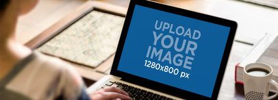 Mockup of a Woman Typing on a MacBook Pro