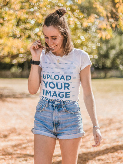 T-Shirt Mockup of a Woman Removing Her Sunglasses at a Park m1467-r-el2