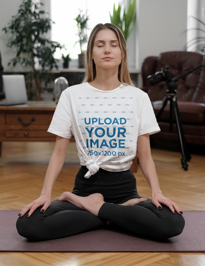 Mockup of a Woman Wearing a Knotted Tee to Meditate at Home