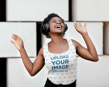 Sublimated Tank Top Mockup Featuring a Short-Haired Woman Listening to Happy Music 