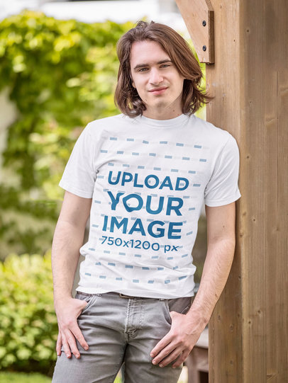 T-Shirt Mockup Featuring a Man Leaning Over a Wooden Column m1486-r-el2