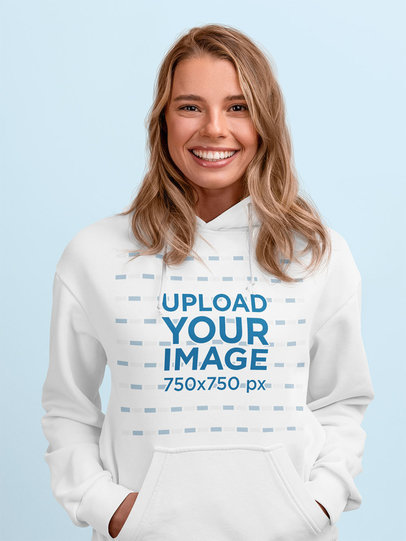 Hoodie Mockup of a Happy Young Woman Standing Against a Colored Backdrop