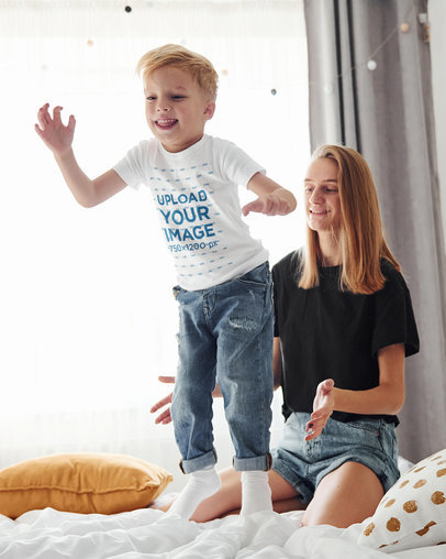 T-Shirt Mockup of a Joyful Kid Jumping on the Bed m2043-r-el2