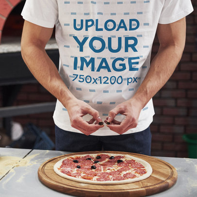 T-Shirt Mockup of a Man Cooking a Pizza