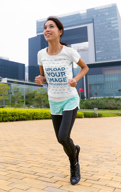 Heather T-Shirt Mockup of a Woman Running at a City Park