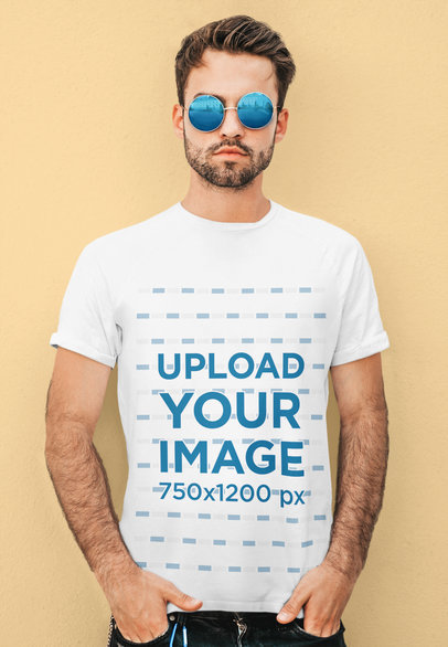 T-Shirt Mockup of a Bearded Man With Sunglasses Posing Against a Plain Backdrop