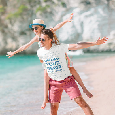 T-Shirt Mockup of a Father Having Fun With His Daughter at the Beach