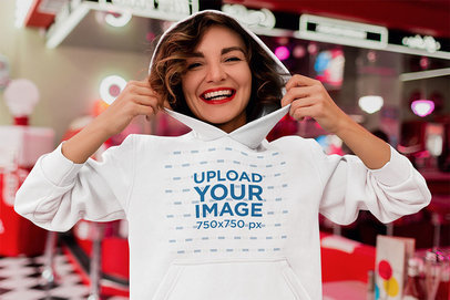 Hoodie Mockup of a Smiling Woman at a Restaurant 