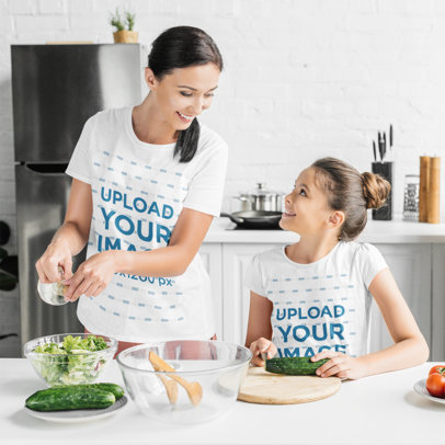 T-Shirt Mockup of a Mother and Daughter Making a Salad at Home