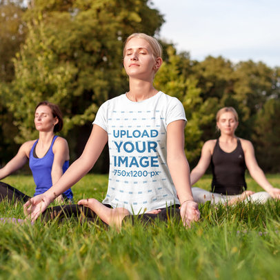 T-Shirt Mockup of a Woman Meditating at an Outdoor Yoga Session