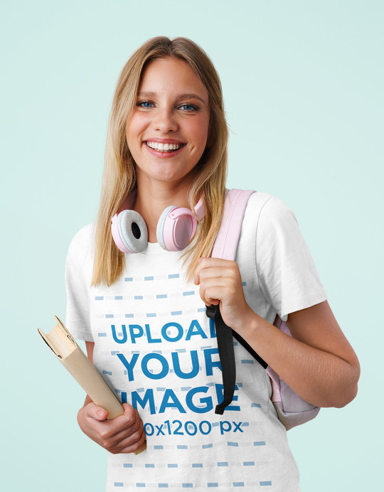 Basic T-Shirt Mockup of a Young Female Student at a Studio 