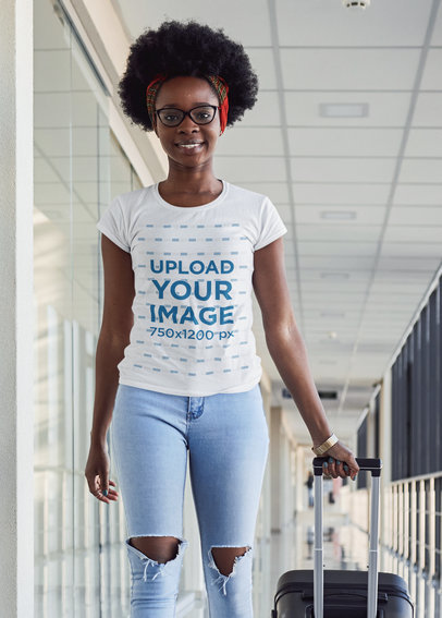 T-Shirt Mockup of a Woman Carrying Her Luggage at the Airport