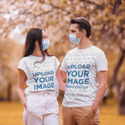 T-Shirt Mockup Featuring a Couple Wearing Face Masks