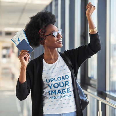T-Shirt Mockup of a Happy Woman Holding Her Passport and Plane Tickets