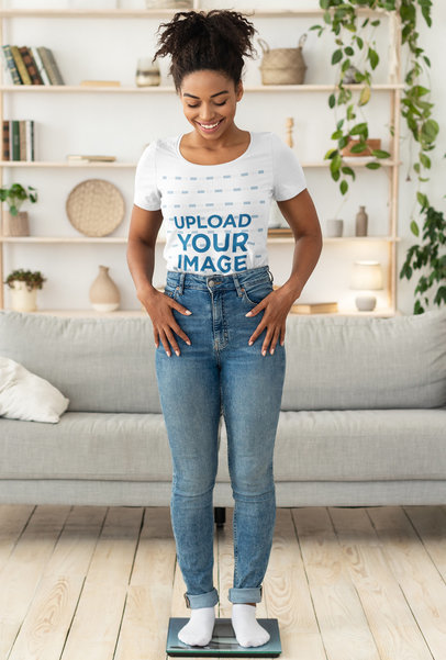 T-Shirt Mockup of a Happy Woman Checking Her Weight