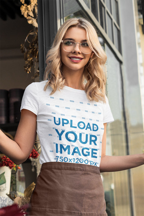 T-Shirt Mockup Featuring a Blonde Woman at Work