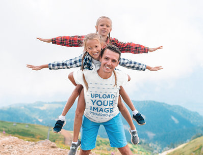 T-Shirt Mockup Featuring a Man With His Daughters