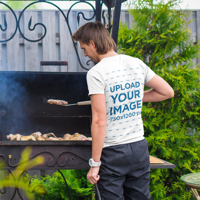 Back-View T-Shirt Mockup of a Man Grilling 