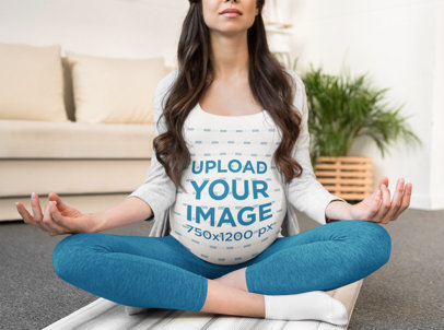 T-Shirt Mockup Featuring a Long-Haired Pregnant Woman Meditating 