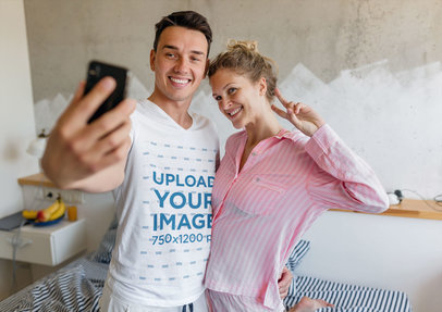 V-Neck T-Shirt Mockup of a Man Taking a Selfie with His Girlfriend in the Morning