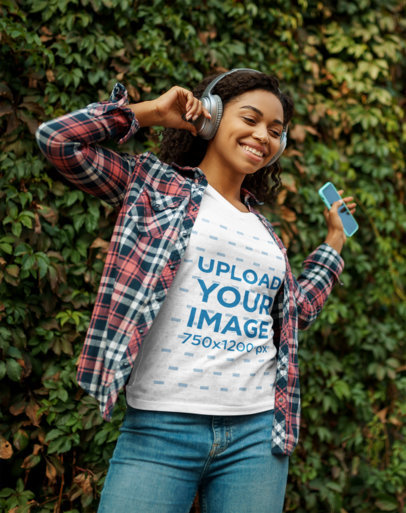 Heather T-Shirt Mockup of a Happy Woman Listening to Music 