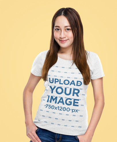Tee Mockup of a Woman with a Shy Smile at a Studio