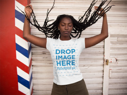 Mockup of a Woman Playing With Her Hair and Wearing a T-Shirt 
