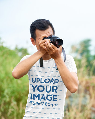 T-Shirt Mockup Featuring a Photographer Working in Nature