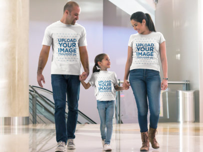 Father Mother and Daughter Walking at the Mall Wearing Different Tshirts Mockup