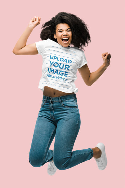 T-Shirt Mockup Featuring a Woman Jumping in a Studio