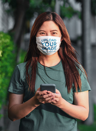 Face Mask Mockup of a Woman with Her Phone on the Street m1819-r-el2