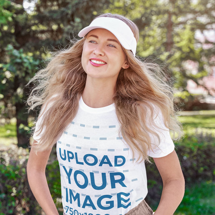 T-Shirt Mockup of a Happy Young Woman Strolling at a Park