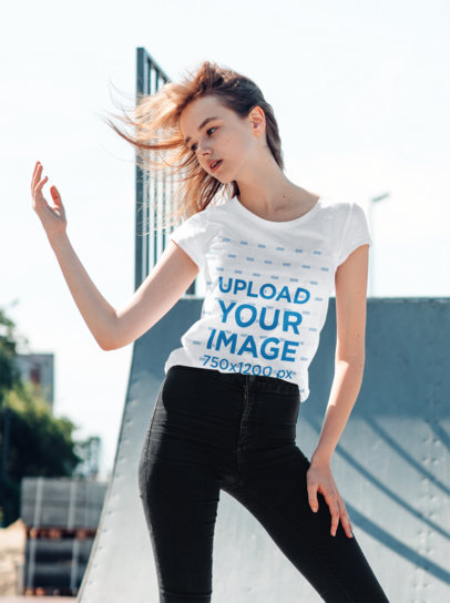 T-Shirt Mockup Featuring a Young Stylish Woman Posing at a Skate Park m2812r-el2
