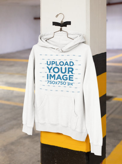 Mockup of a Hoodie Hanging From a Column 