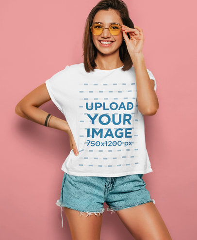 T-Shirt Mockup of a Happy Woman Holding Her Colored Glasses