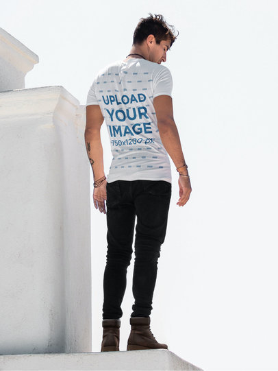 Back-View T-Shirt Mockup Featuring a Man Standing on a Ledge m1747-r-el2