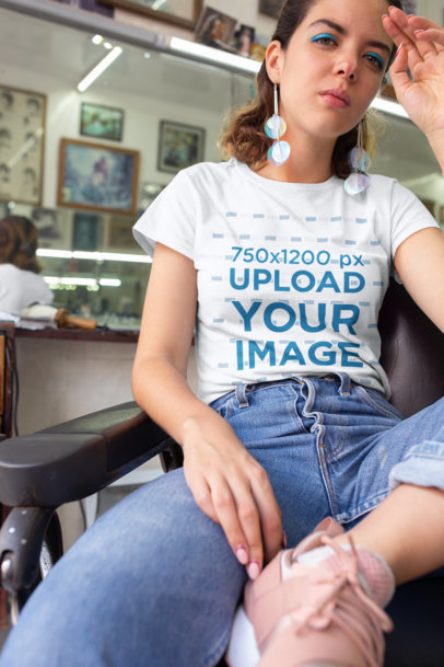 T-Shirt Mockup of a Young Woman at a Vintage Barbershop 22723a