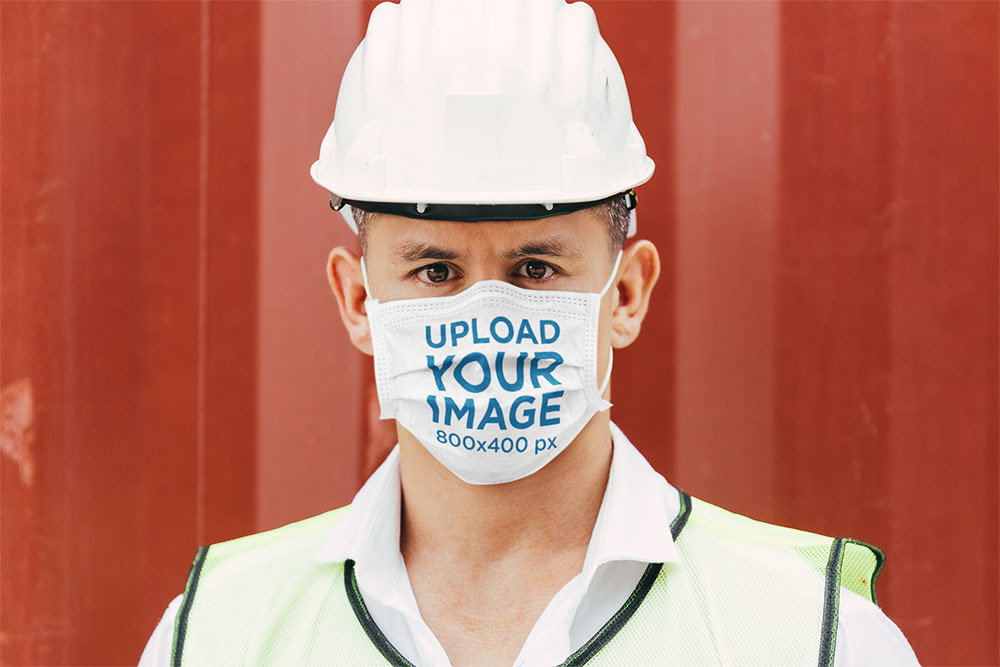 Face Mask Mockup Featuring a Serious Construction Worker