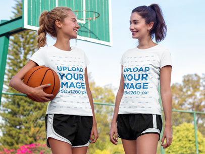 Pair of Women Wearing Different T-Shirts Mockup While Hanging Out in a Basketball Court