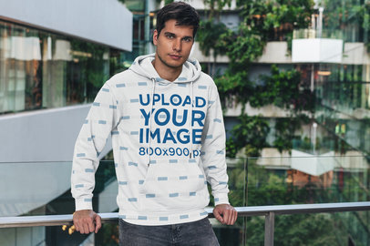 Sublimated Hoodie Mockup Featuring a Man Posing by a Handrail 