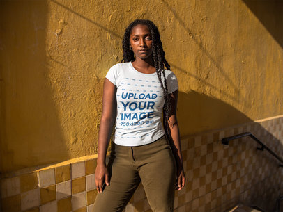 Young Pretty Woman Wearing a Tee Mockup While Standing in a Yellow House