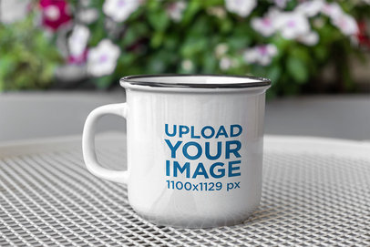 12 oz Enamel Mug Mockup Placed Near Some Flowers 