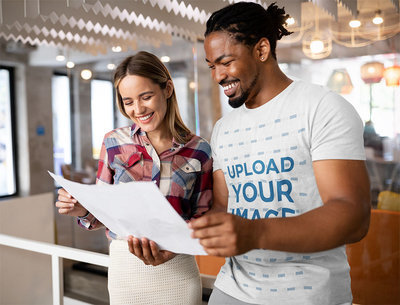 T-Shirt Mockup of a Man Reviewing a Plan with a Coworker 42599-r-el2