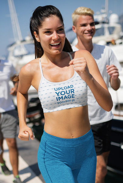 Sports Bra Mockup of a Happy Woman Running on a Sunny Day