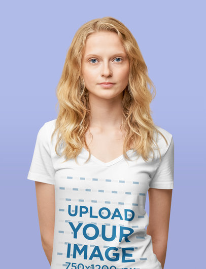 V-Neck Tee Mockup Featuring a Woman Standing Against a Customizable Surface