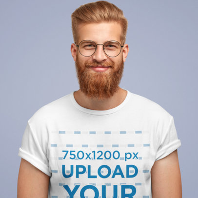 T-Shirt Mockup of a Bearded Man With Glasses in a Studio