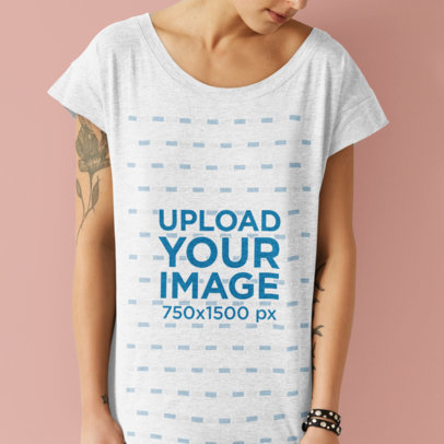 Mockup of a Tattooed Woman Wearing a Heather T-Shirt at a Studio