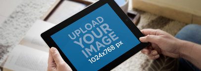 Mockup of a Person Using an iPad at Home