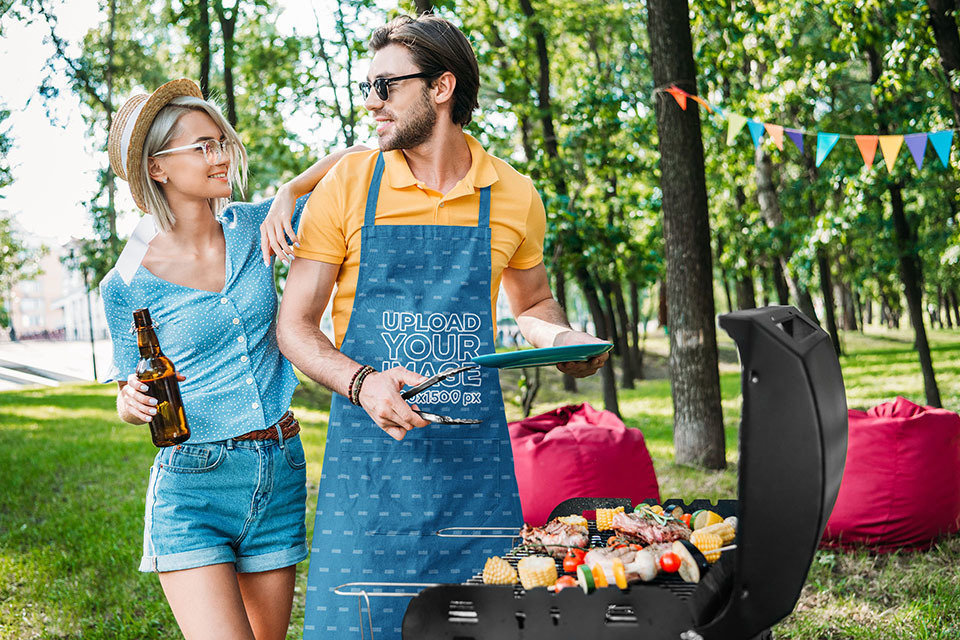 Apron Mockup of a Man Preparing Barbecue for His Girlfriend